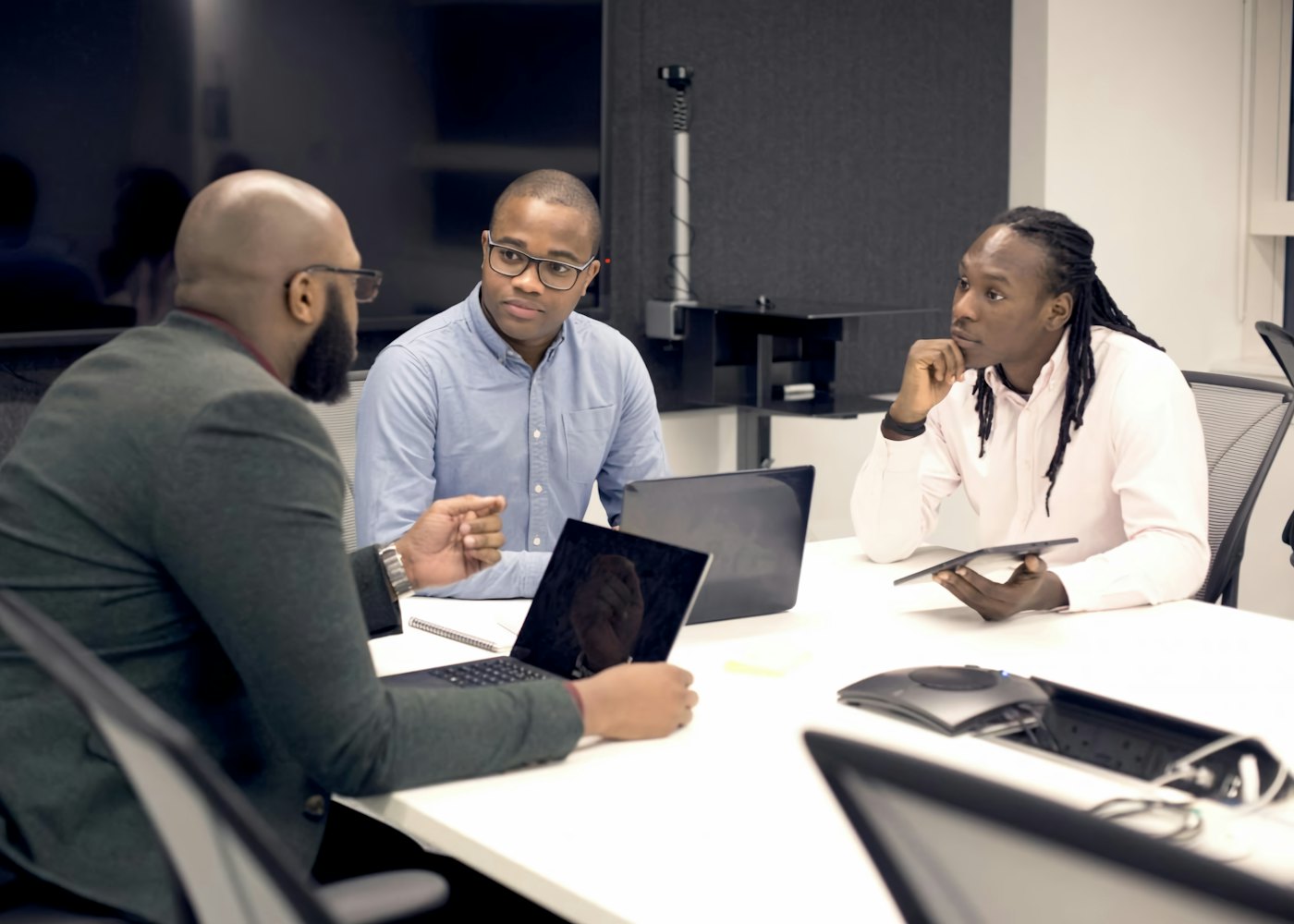 Leaders discussing strategy in a meeting room