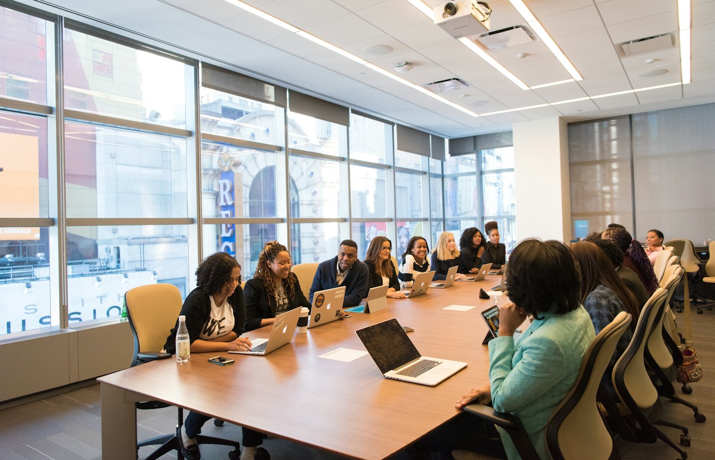 Participants seated around a boardroom table during a working session